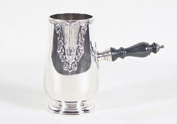 Embossed silver milk jug with ebonized wood handle, gr. 280