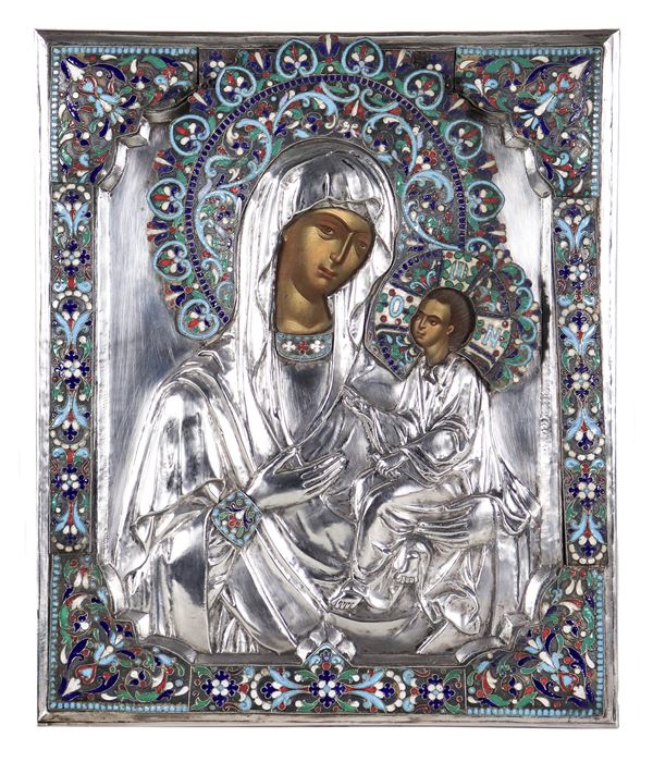 "Mother of God of Tikhvin", icon painted on wood with embossed silver bristles and applications of polychrome enamels with floral scroll motifs