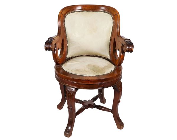 Swivel armchair in walnut, with four curved legs joined by a cross underneath