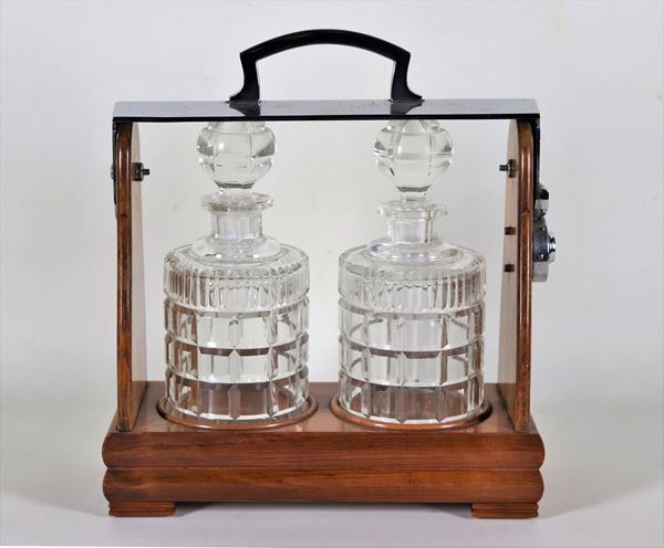 Tantalus in walnut with two liqueur bottles in worked crystal