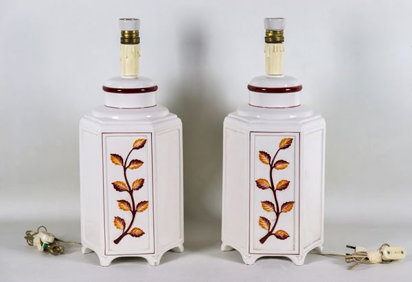 Pair of hexagonal table lamps, in white glazed ceramic with brown and yellow leaves in relief
