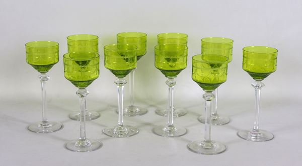 Lot of ten goblets in green Bohemian crystal, engraved with Louis XVI motifs