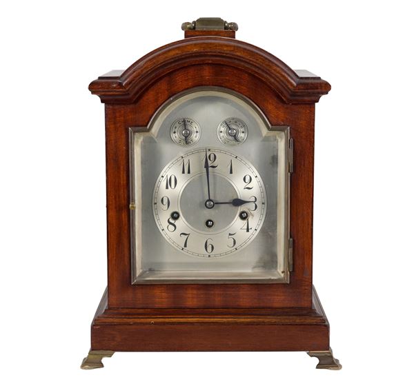 German table clock Junghans Wurttenberg in the shape of a small temple in walnut, with hour and half hour bell chime