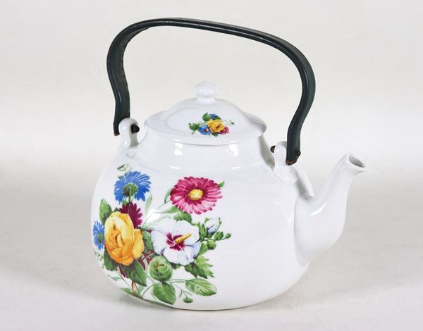 French porcelain teapot, with colorful decorations with bunches of flowers, handle covered in leather