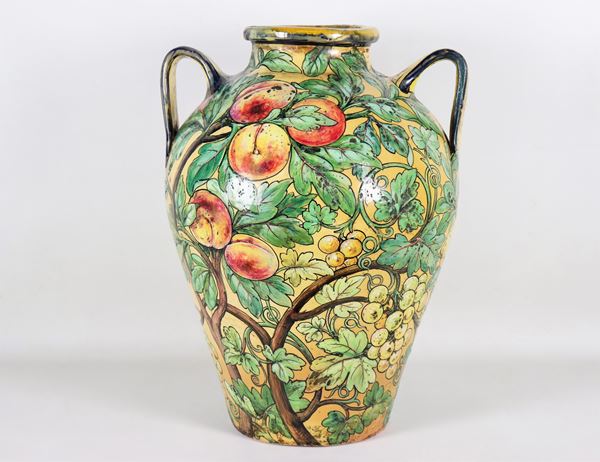 Large amphora in majolica and glazed terracotta, marked C.A.P. (Piediluco Artistic Ceramics), entirely decorated and colorful with fruit motifs