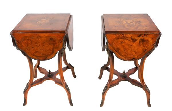 Pair of center tables with strips in walnut, rosewood and purple ebony, with tops inlaid with scrolls and musical instruments in the center