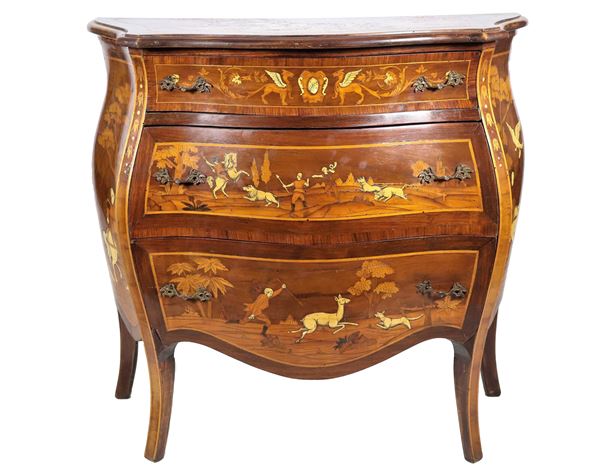 Small rounded-shaped Lombard chest of drawers in walnut, entirely inlaid in various precious woods with motifs of hunting scenes
