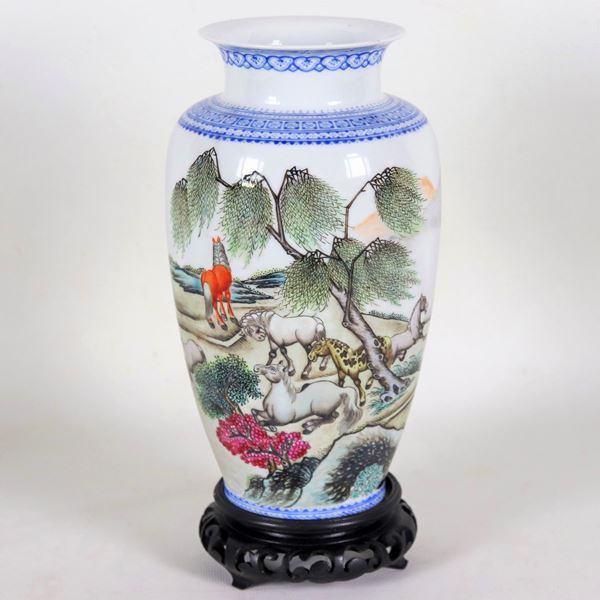 Small Chinese porcelain vase, with relief enamel decorations with motifs of animals and exotic trees