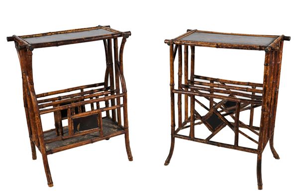 Lot of two French Liberty coffee tables in faux bamboo, with black lacquered tops decorated with floral motifs