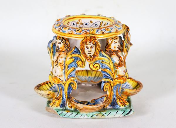 Italian glazed majolica salt cellar in the shape of a stand with caryatids and shells