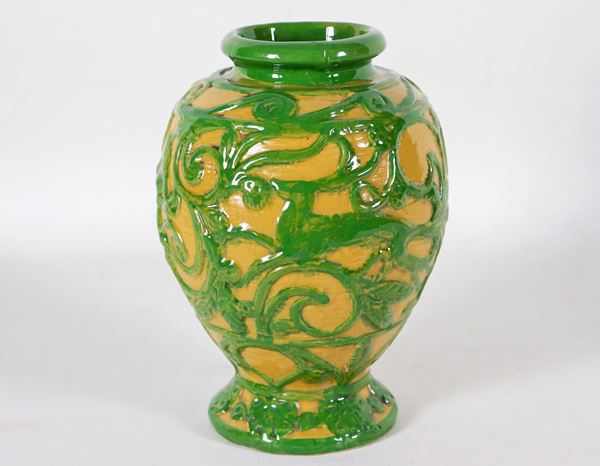 Glazed majolica vase, decorated in green relief with motifs of volutes with figures and animals, marked V.C. Vincent Leonardo Current (1887-1967)