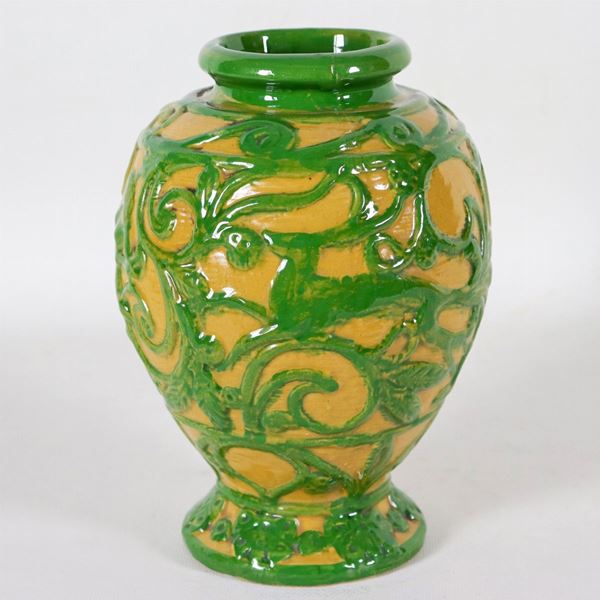 Vaso in maiolica smaltata, decorata a rilievo in verde a motivi di volute con figure e animali, marcato V.C. Vincenzo Leonardo Corrente (1887-1967)