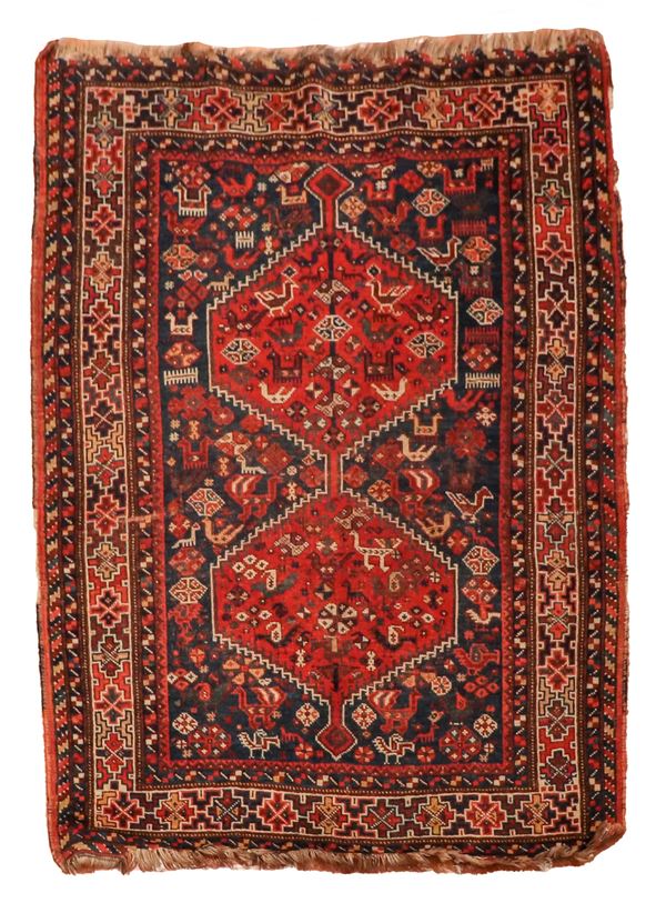 Shirvan carpet with geometric motifs on a red and blue background, slight defects on the border, M. 1.54 x 1.11