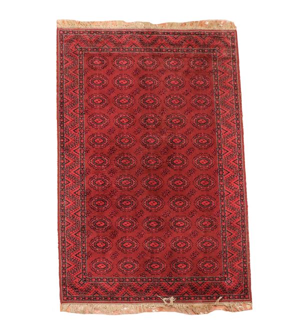 Yomut carpet with geometric designs on a red background, M. 2.54 x 1.45