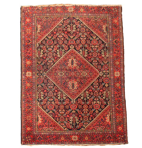 Tappeto Shirvan a disegni geometrici e floreali su fondo rosso e blu, M. 2,02 x 1,39