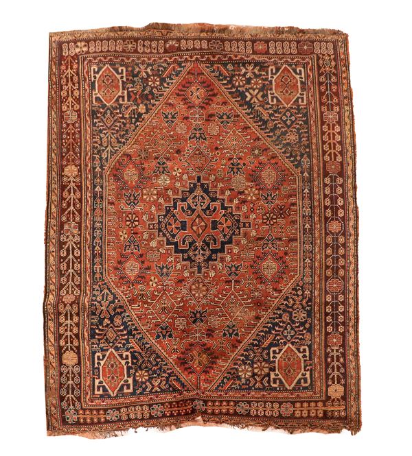 Saveh carpet with geometric and floral designs on a blue and brick background, slight defects on the edges, M. 2.45 x 1.65
