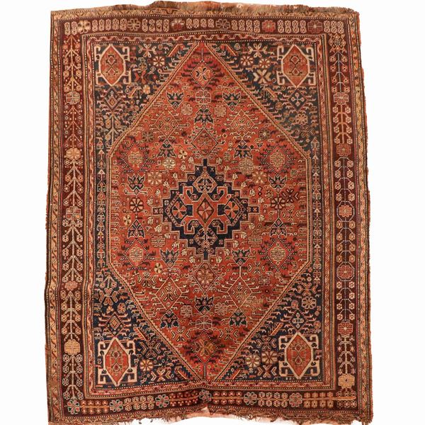 Saveh carpet with geometric and floral designs on a blue and brick background, slight defects on the edges, M. 2.45 x 1.65