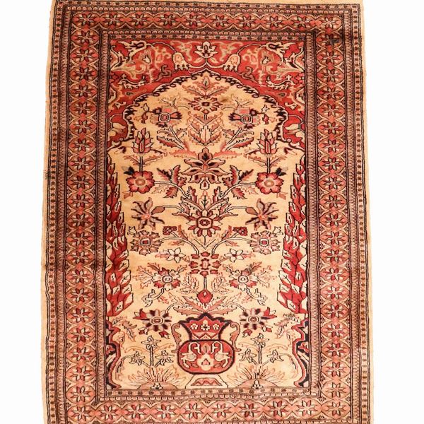 Heriz carpet with geometric and floral designs on a havana and red background, M. 1.63 x 0.94