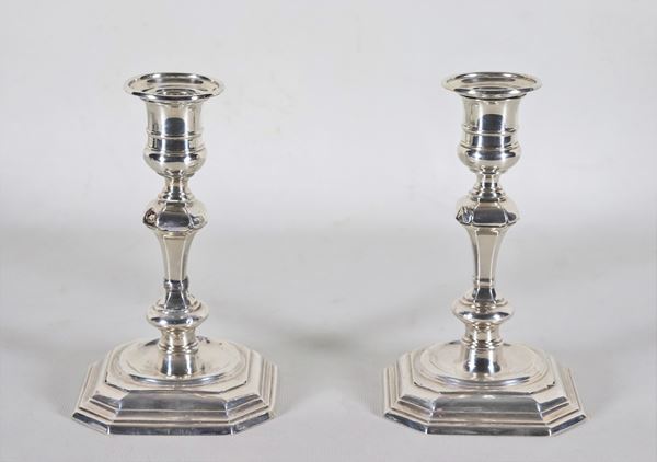 Pair of Queen Victoria period candlesticks in chiselled and embossed silver, some flaws
