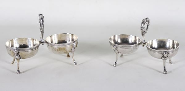 Coppia di doppie salierine in argento Periodo Ferdinando II, con manici a forma di teste di leoni e quattro piedini a forma di cariatidi, gr. 400