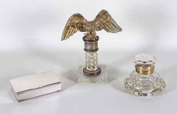 Lot in silvered metal, bronze and crystal of a column paperweight with an eagle above, an inkwell and a cigarette case (3 pcs)
