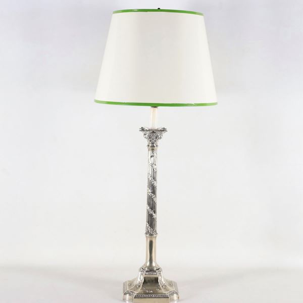 Antique large column-shaped candlestick in silvered metal, embossed and chiseled with Louis XVI motifs