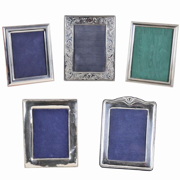 Lot of five picture frames in chiselled and embossed silver