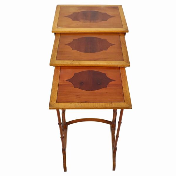 Nest of three cherrywood tables, with inlaid tops and turned legs