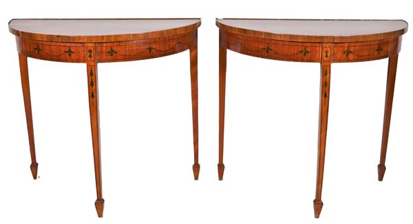 Pair of English demi-lune consoles in satinwood, with painted decorations with Sheraton motifs, three inverted pyramid legs