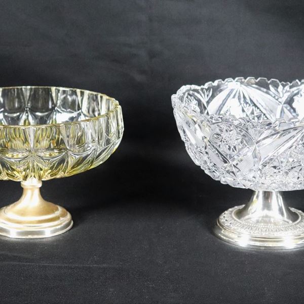 Lot of two raised centerpieces in worked crystal, supported by silver bases