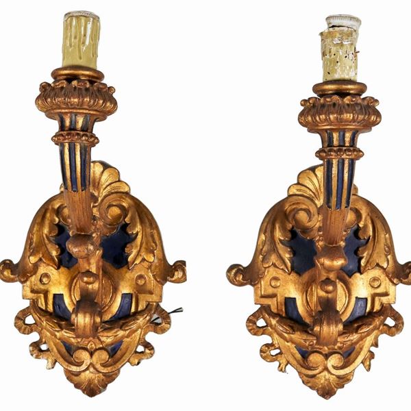 Pair of wall arms in gilded and carved wood with Louis XIV motifs