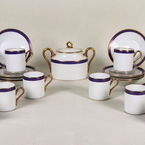 Lot of a sugar bowl and twelve coffee cups with saucers in Richard Ginori white porcelain, cobalt blue edges and golden handles (13 pcs)