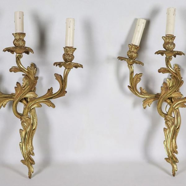 Pair of French sconces in gilded and embossed bronze with Louis XV motifs, 3 lights each