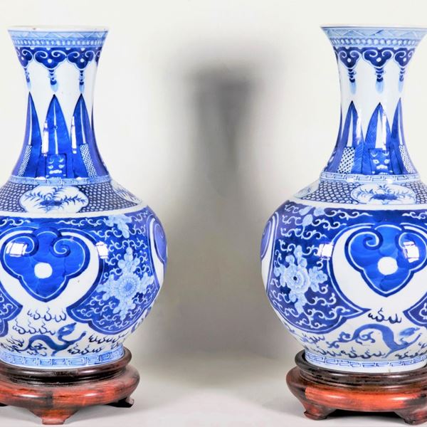 Pair of Chinese vases in white and blue porcelain, with oriental floral motif decorations