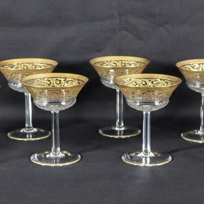 Lot of eleven champagne goblets in worked crystal with pure gold edges