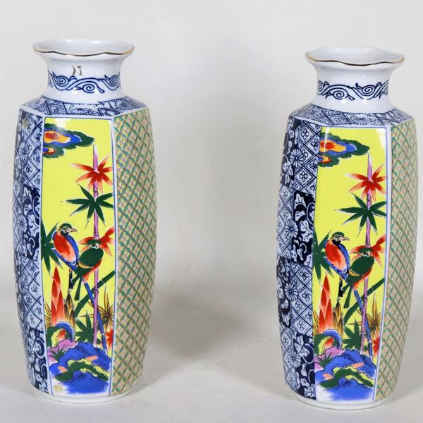 Pair of hexagonal Chinese porcelain vases, with relief enamel decorations with flower and bird motifs