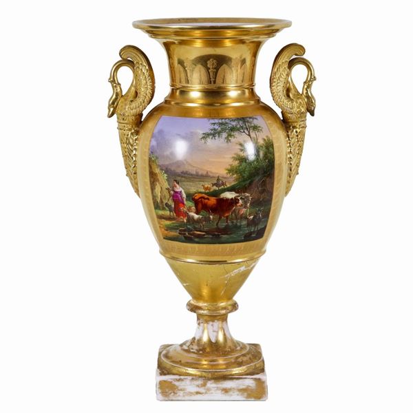 Empire period amphora vase in gilded porcelain, with painted squares of "peasant scenes" and handles with sculptures of swans, the base of the vase has damages