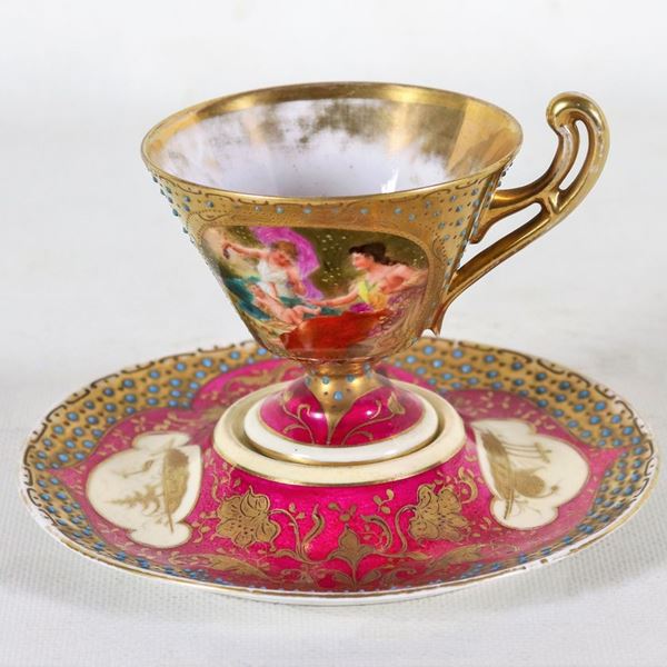 Cup and saucer in Old Vienna porcelain, entirely decorated with pure gold scrolls on an antique pink background and medallion with a mythological scene, applications in turquoise enamel