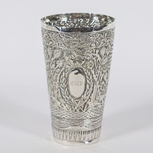 Antique glass in silver-plated metal entirely embossed and chiseled with hunting scenes in the jungle