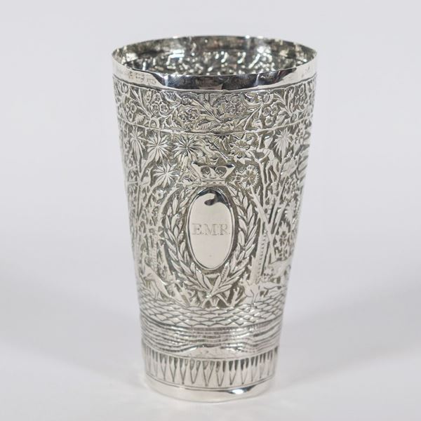 Antique glass in silver-plated metal entirely embossed and chiseled with hunting scenes in the jungle