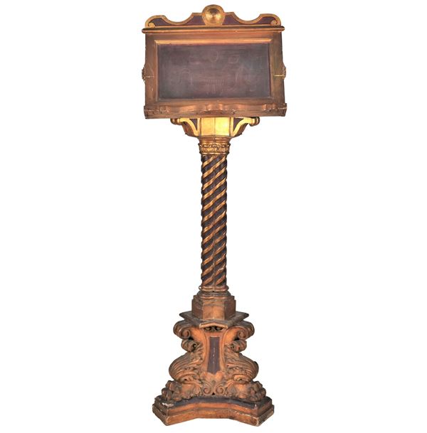 Ancient large standing lectern in polychrome wood, gilded and carved with acanthus leaf motifs, twisted column supported by a triangular base with leonine feet. Defects