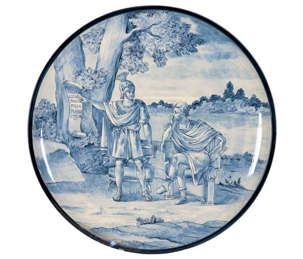 Large majolica plate, entirely decorated in blue with characters from Ancient Rome, defect on the edge