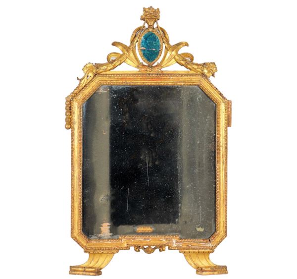 Ancient small Roman Louis XVI octagonal mirror, in gilded wood and carved with motifs of leaves, flowers and beading, mercury mirror