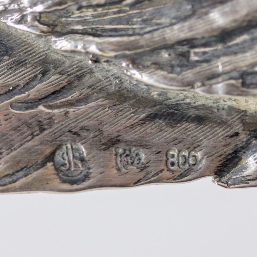 "Fagiani", coppia di sculture in argento cesellato e sbalzato con teste estraibili, gr. 1700