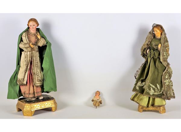 "Madonne and Child", lot of three ancient Neapolitan crib puppets in polychrome terracotta with original fabric clothes