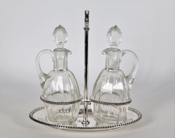 Silver-plated metal cruet with chiseled and embossed edges, two crystal ampoules