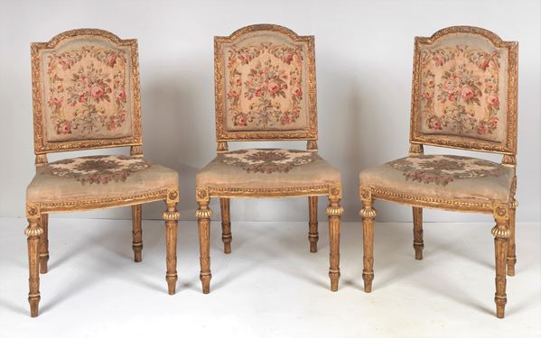 Lot of three antique Louis XVI French chairs in gilded and carved wood, covering in gobelin floral fabric with defects