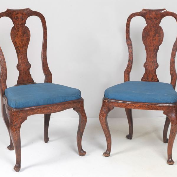 Pair of antique Dutch walnut chairs, entirely inlaid in various woods with figures of cherubs and floral intertwining, four curved legs