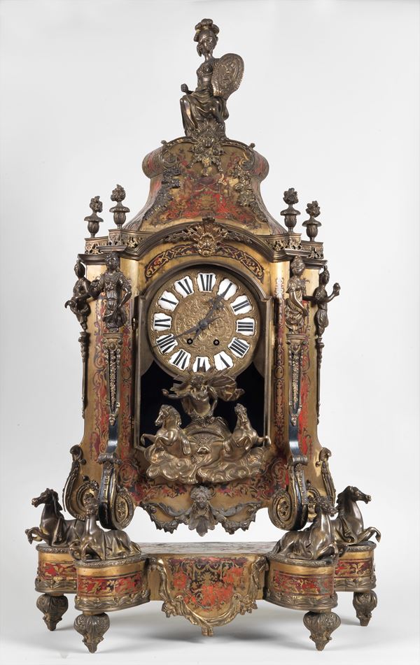 Ancient large French clock "Aux Chevaux", attributed to the cabinetmaker Lescure-Paris, in red lacquer entirely inlaid with Boulle motifs, with friezes and sculptures in gilded and chiseled bronze with Minerva, Apollo with chariot, horses and female figures, dial with Roman numerals in enamel