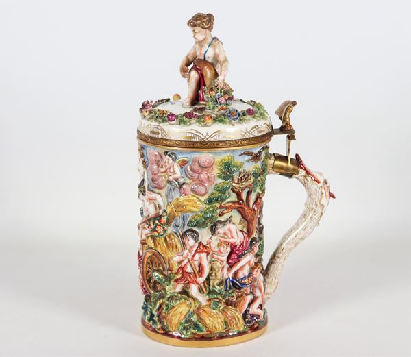Large mug in Capodimonte historiated porcelain, entirely decorated in polychrome with mythological scenes in relief